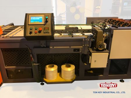 Unidad de plegado y costura